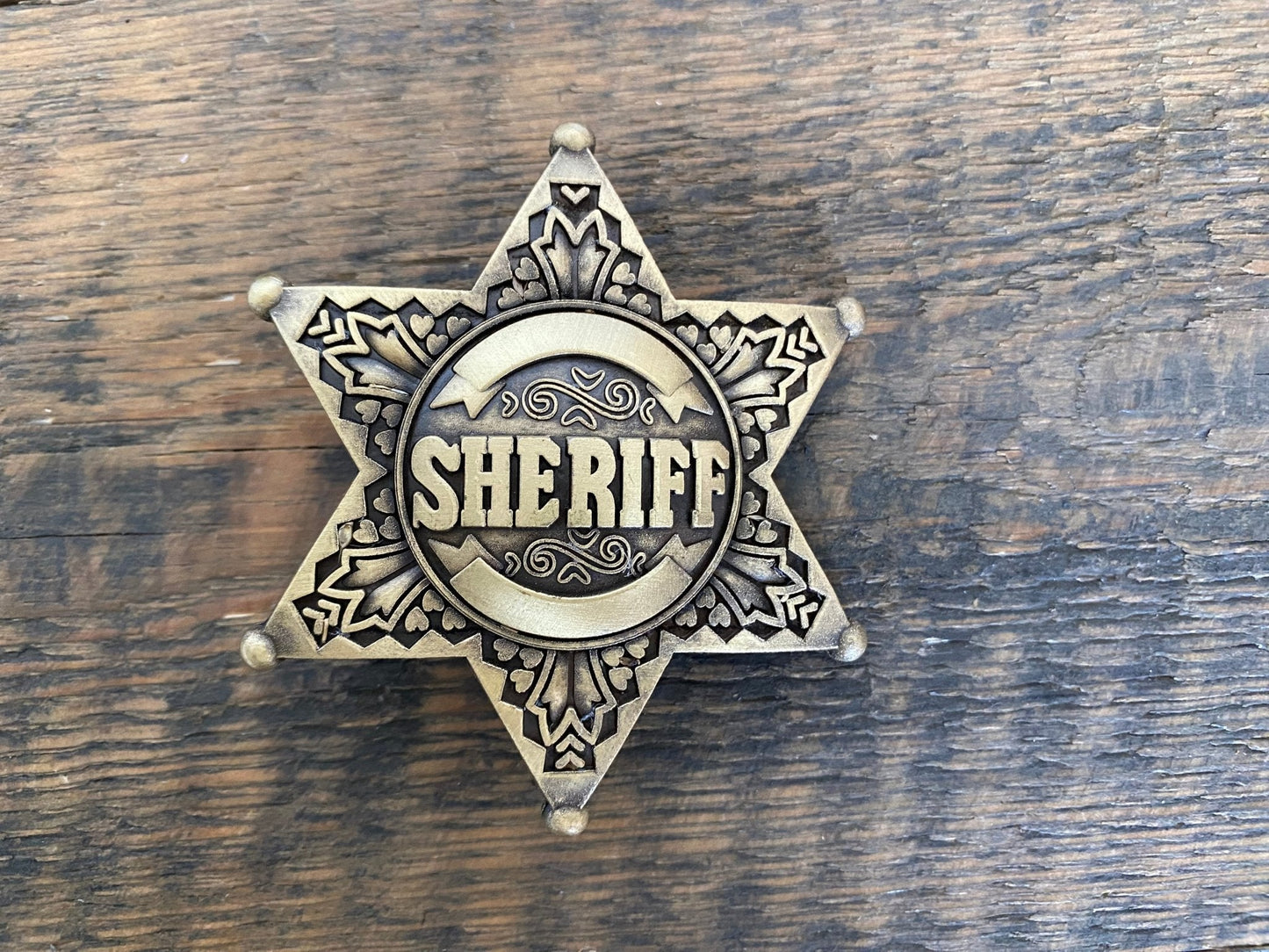 Klamra- SHERIFF w kolorze złotym